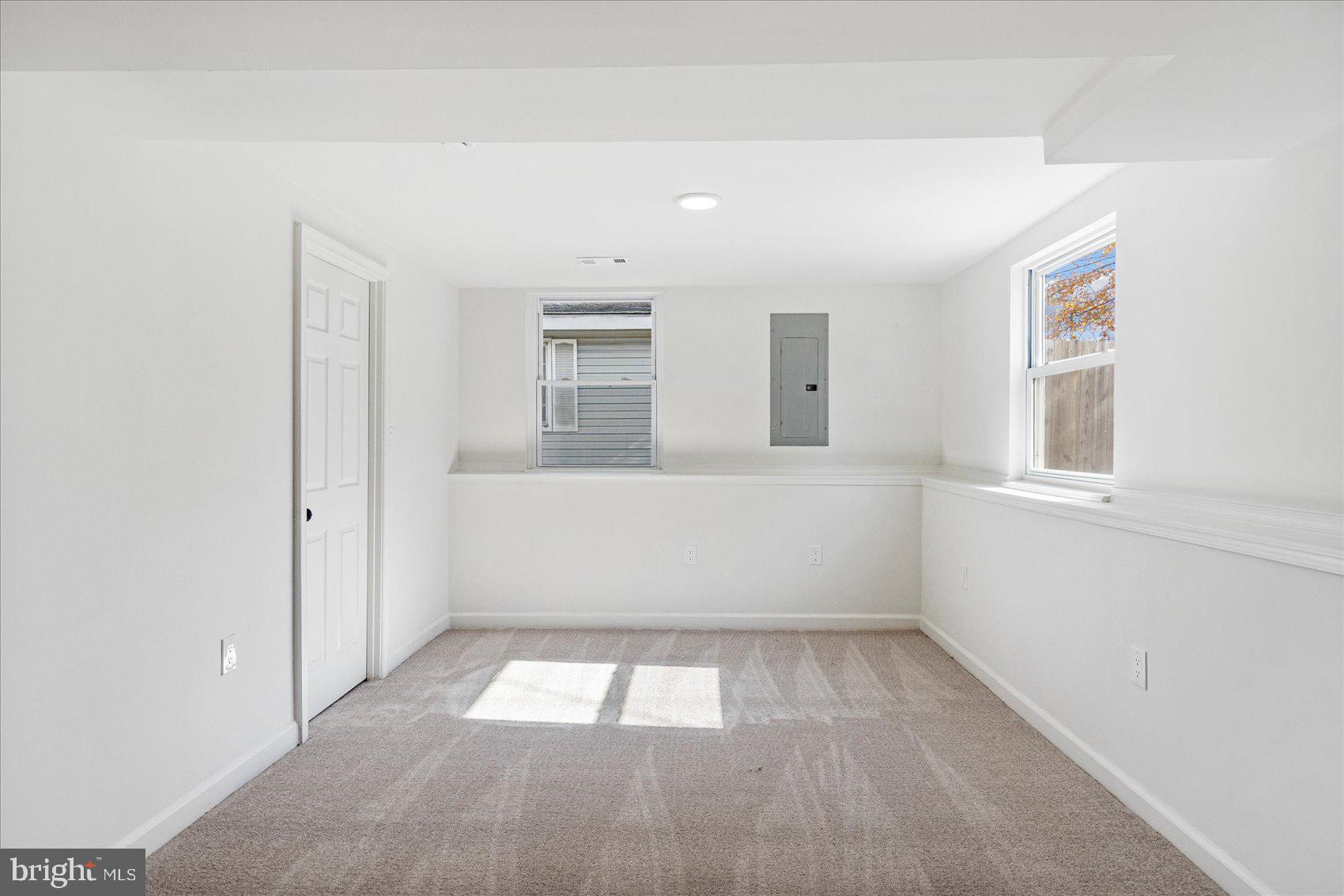 7803 Brevort Road Windsor Mill, MD 21244 - Photo 23 of 45 an empty room with windows