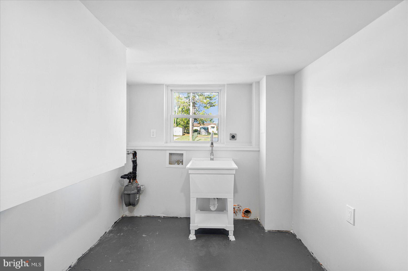 7803 Brevort Road Windsor Mill, MD 21244 - Photo 28 of 45 a room with a sink and a window