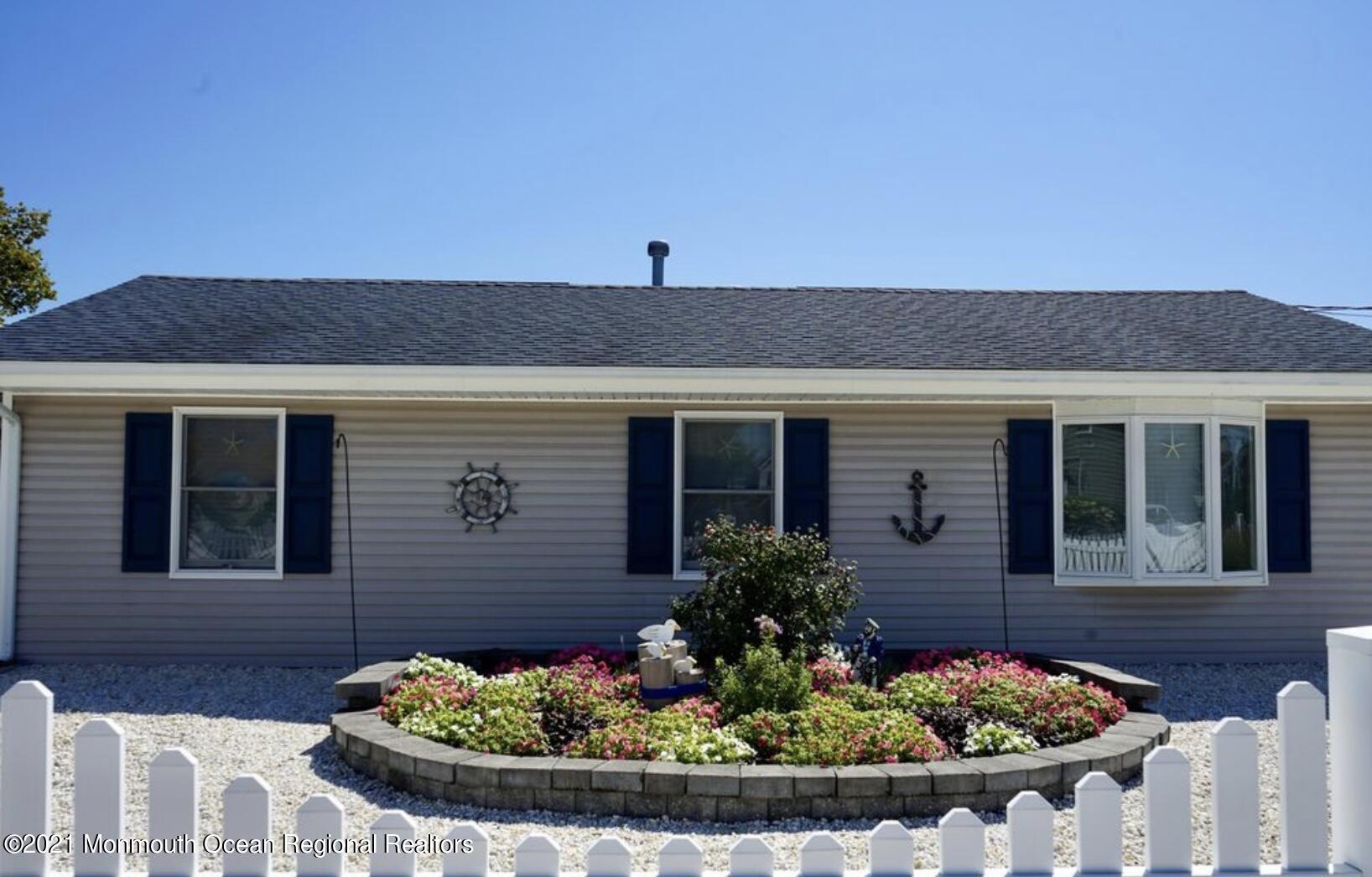102 Bloomfield Road Barnegat, NJ 08005 - Photo 2 of 29 a front view of a house with a yard