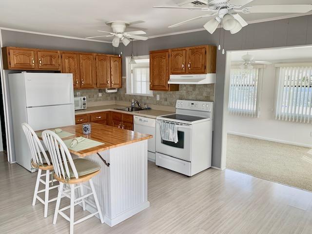 102 Bloomfield Road Barnegat, NJ 08005 - Photo 18 of 29 a kitchen with a stove a sink and a refrigerator