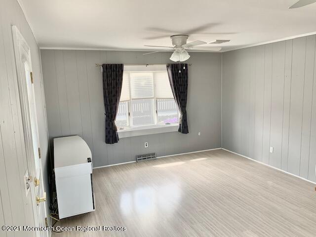 102 Bloomfield Road Barnegat, NJ 08005 - Photo 22 of 29 a view of an empty room with wooden floor and a window