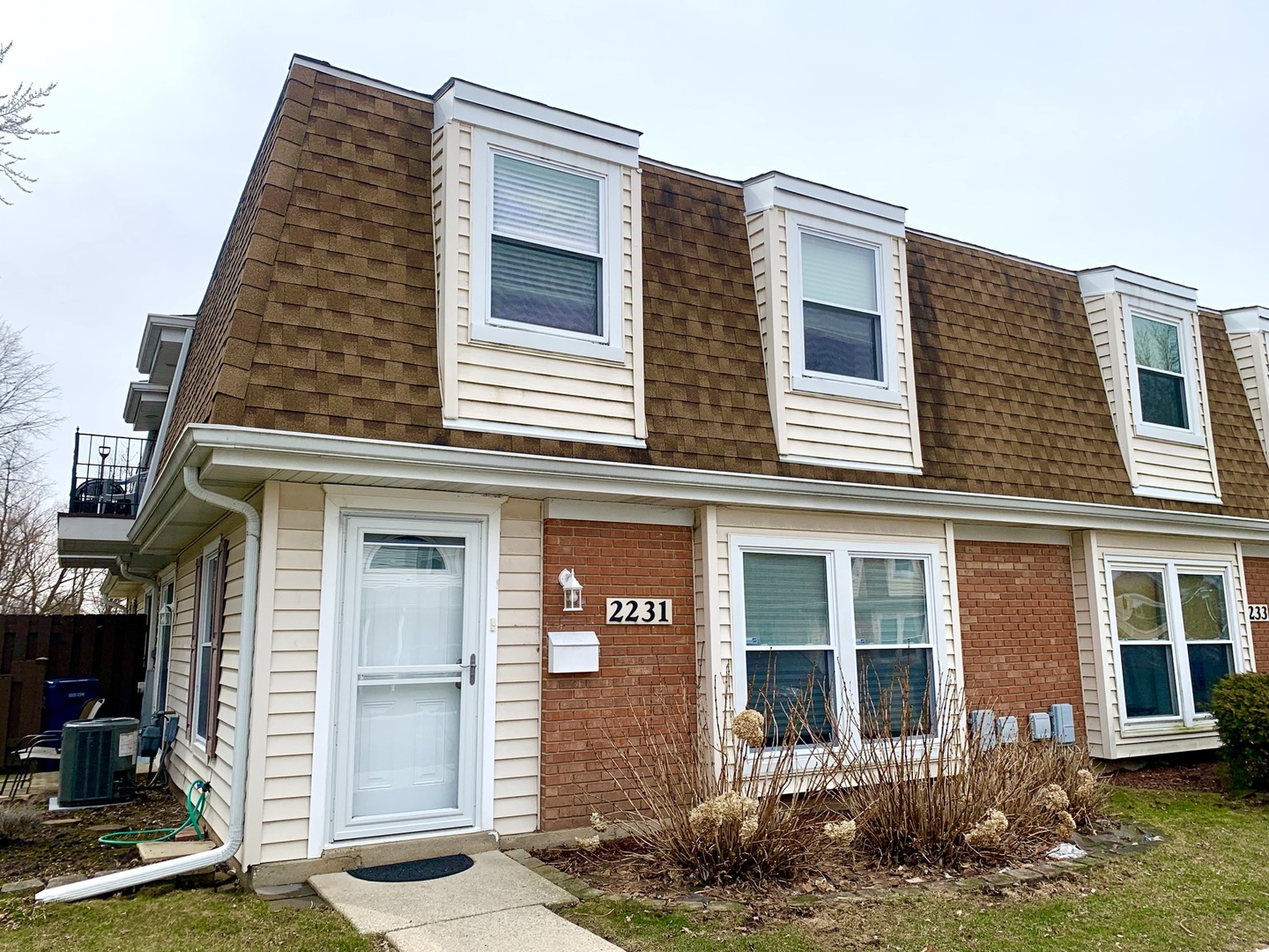 2231 Flower Court, Unit 2231 Schaumburg, IL 60107 - Photo 1 of 24 a front view of a house