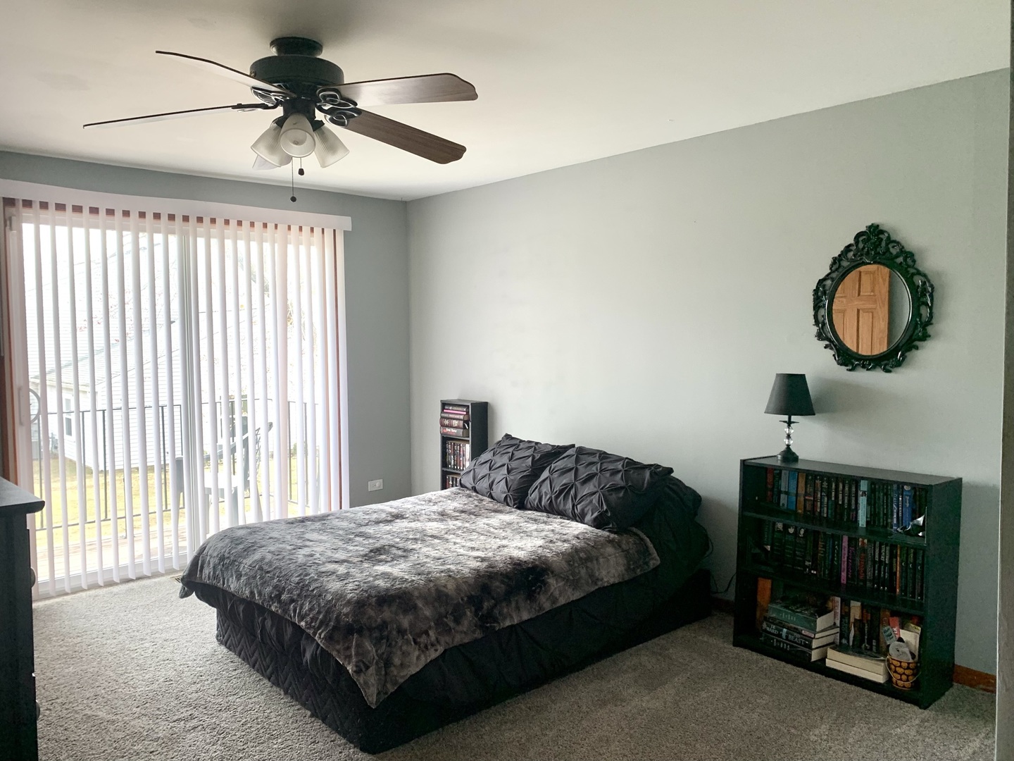 2231 Flower Court, Unit 2231 Schaumburg, IL 60107 - Photo 11 of 24 a bedroom with a bed and a chandelier