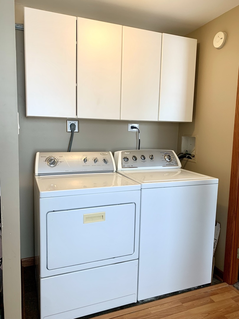 2231 Flower Court, Unit 2231 Schaumburg, IL 60107 - Photo 20 of 24 a utility room with dryer and washer