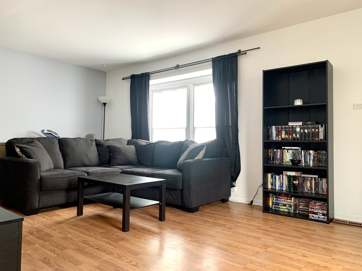 2231 Flower Court, Unit 2231 Schaumburg, IL 60107 - Photo 3 of 24 a living room with furniture and a book shelf