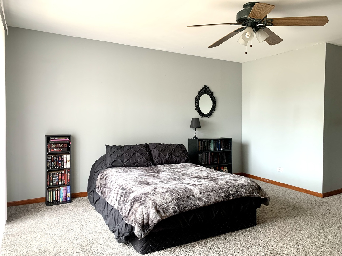 2231 Flower Court, Unit 2231 Schaumburg, IL 60107 - Photo 9 of 24 a bedroom with a bed and a chandelier