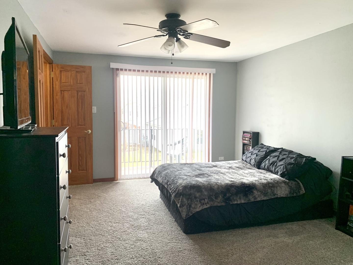 2231 Flower Court, Unit 2231 Schaumburg, IL 60107 - Photo 10 of 24 a bedroom with a bed a window and a chandelier