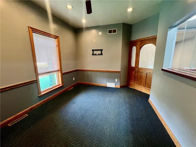 a view of room with window and wooden floor