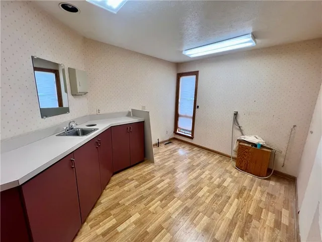 a bedroom with a bed and a sink