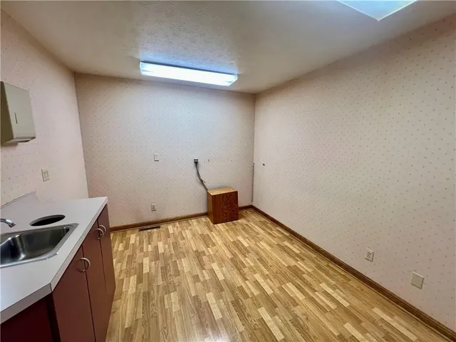 a bedroom with a bed and cabinets