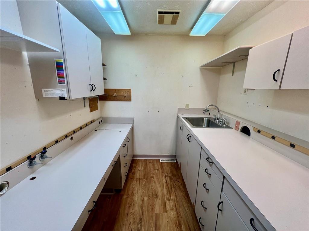 3121 Wilmington Road, Unit 2 New Castle, PA 16105 - Photo 10 of 12 a room with a sink a stove and a refrigerator