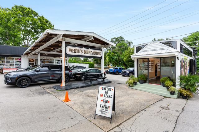 a view of a car parked in front of house