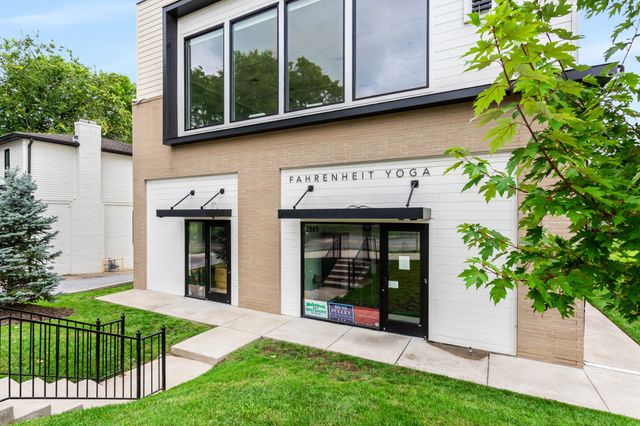 a view of a house with a yard and plants