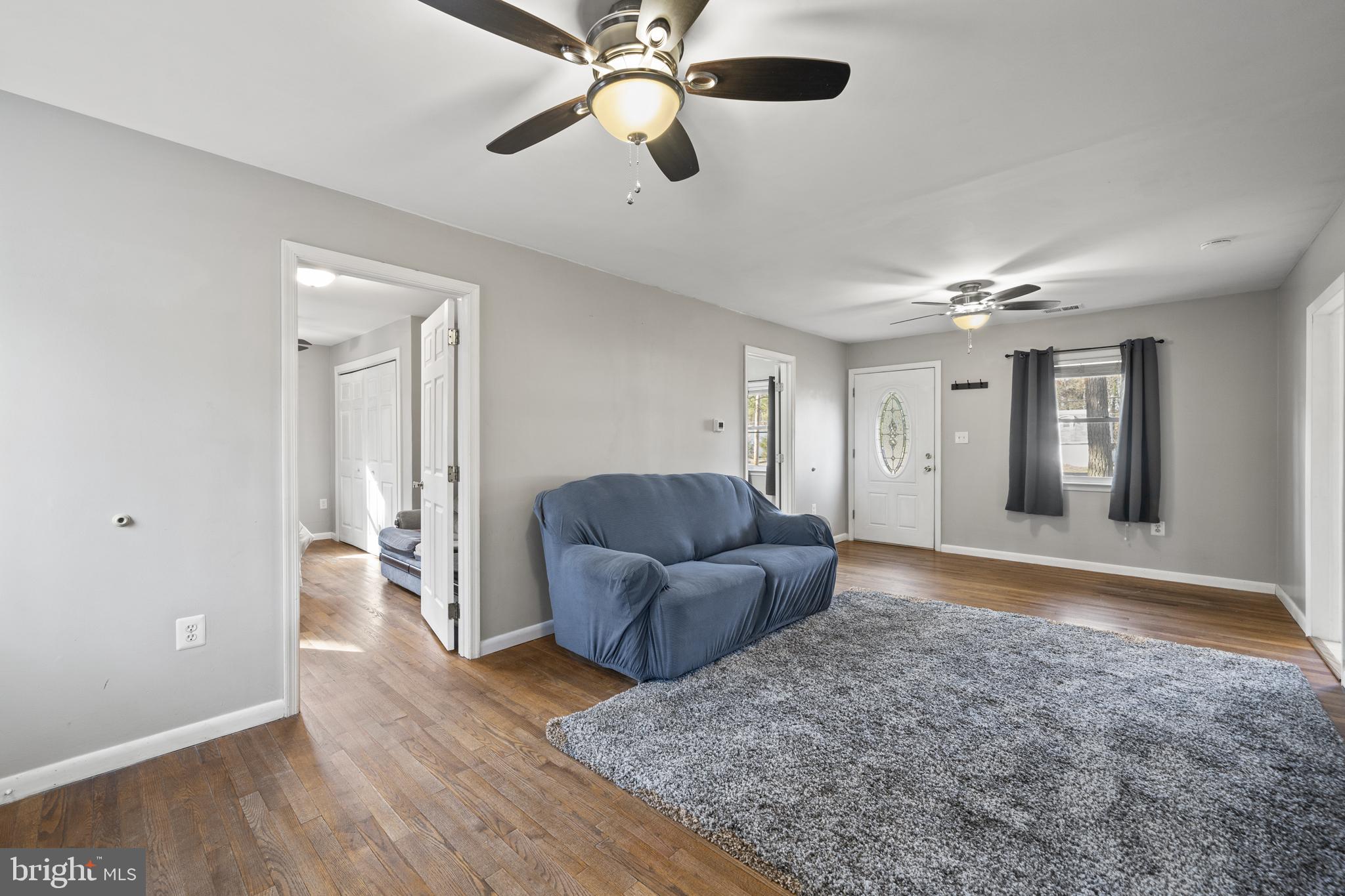 20350 Colton Point Road Coltons Point, MD 20626 - Photo 14 of 30 a living room with furniture and a wooden floor
