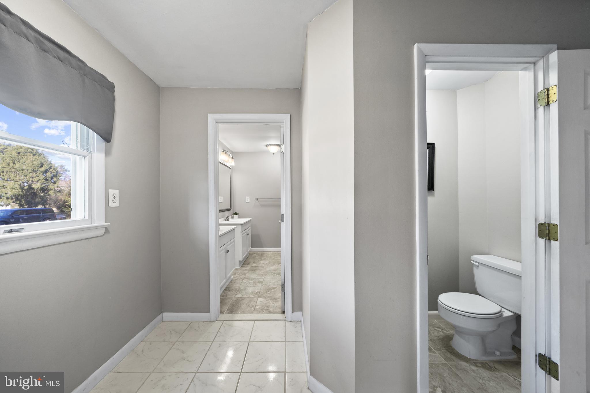 20350 Colton Point Road Coltons Point, MD 20626 - Photo 21 of 30 a bathroom with a toilet and a shower