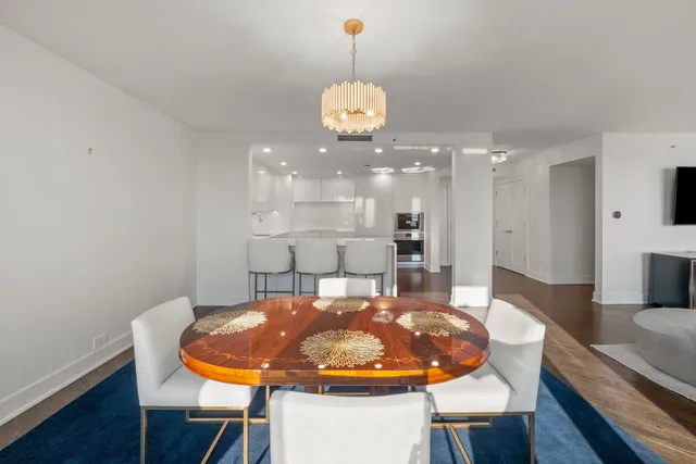 a very nice looking dining room with a table and chairs
