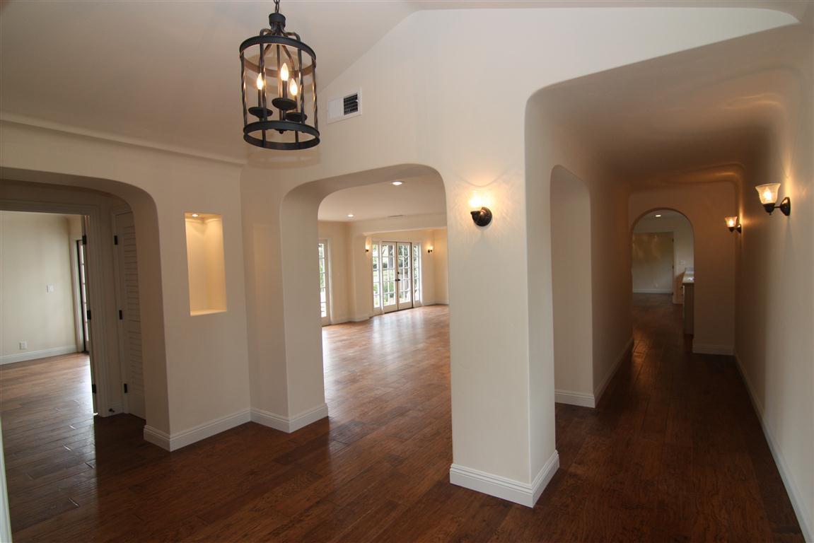 1183 Mesa Road Santa Barbara, CA 93108 - Photo 4 of 24 a view of a hallway with wooden floor and staircase