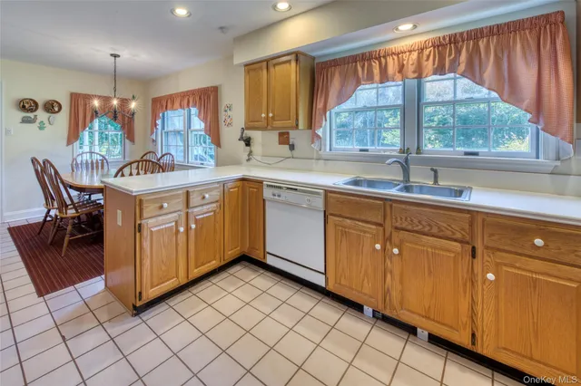 a kitchen with sink cabinets and window