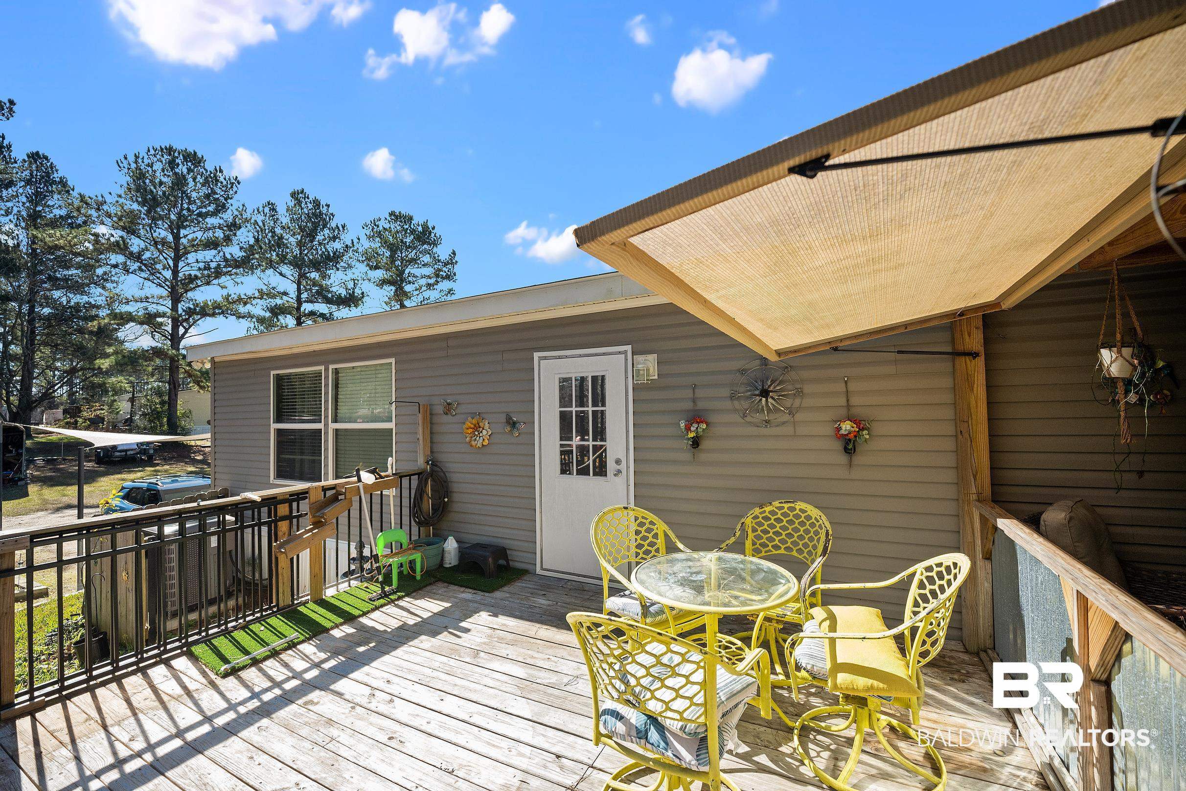 8630 Allison Lane Wilmer, AL 36587 - Photo 27 of 31 Wooden terrace featuring outdoor dining space