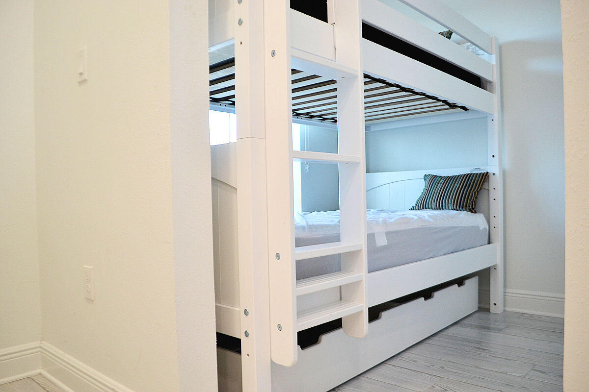 1740 South Co Highway 393, Unit #312 Santa Rosa Beach, FL 32459 - Photo 14 of 36 a view of hallway with stairs and wooden floor
