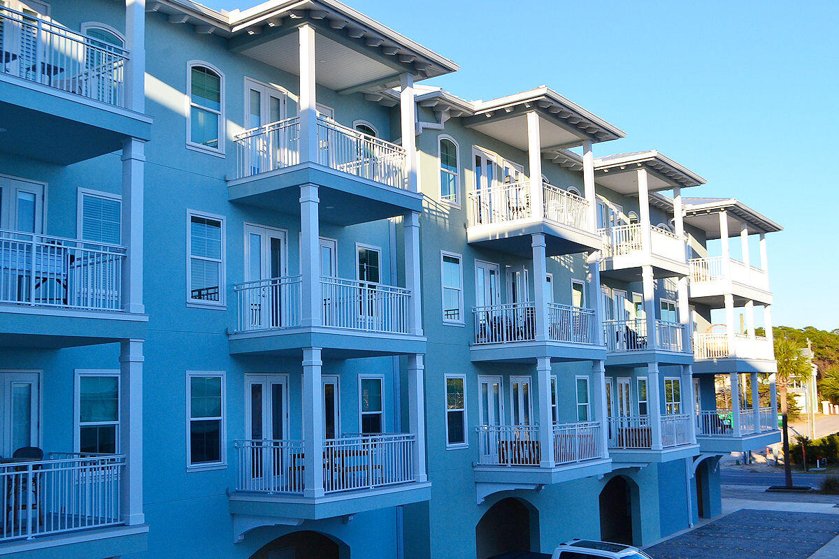 1740 South Co Highway 393, Unit #312 Santa Rosa Beach, FL 32459 - Photo 17 of 36 a front view of a building with glass windows