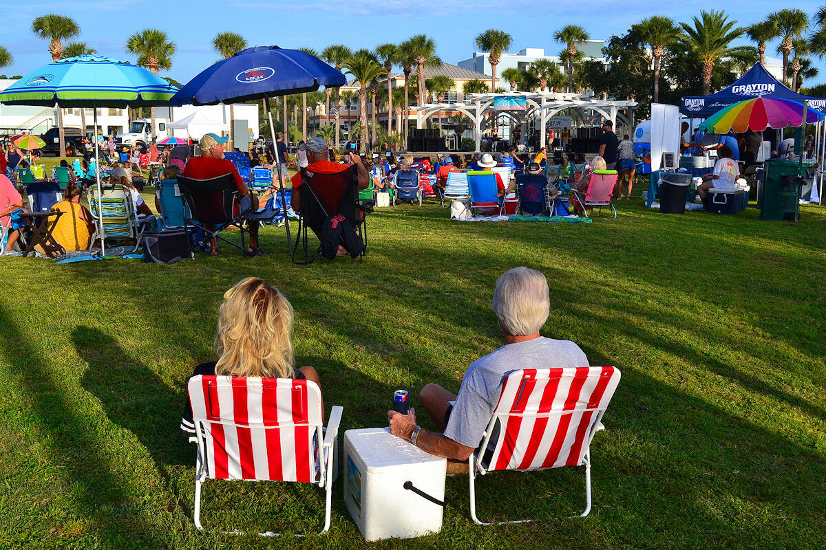 1740 South Co Highway 393, Unit #312 Santa Rosa Beach, FL 32459 - Photo 29 of 36 a group of people sitting in a big yard