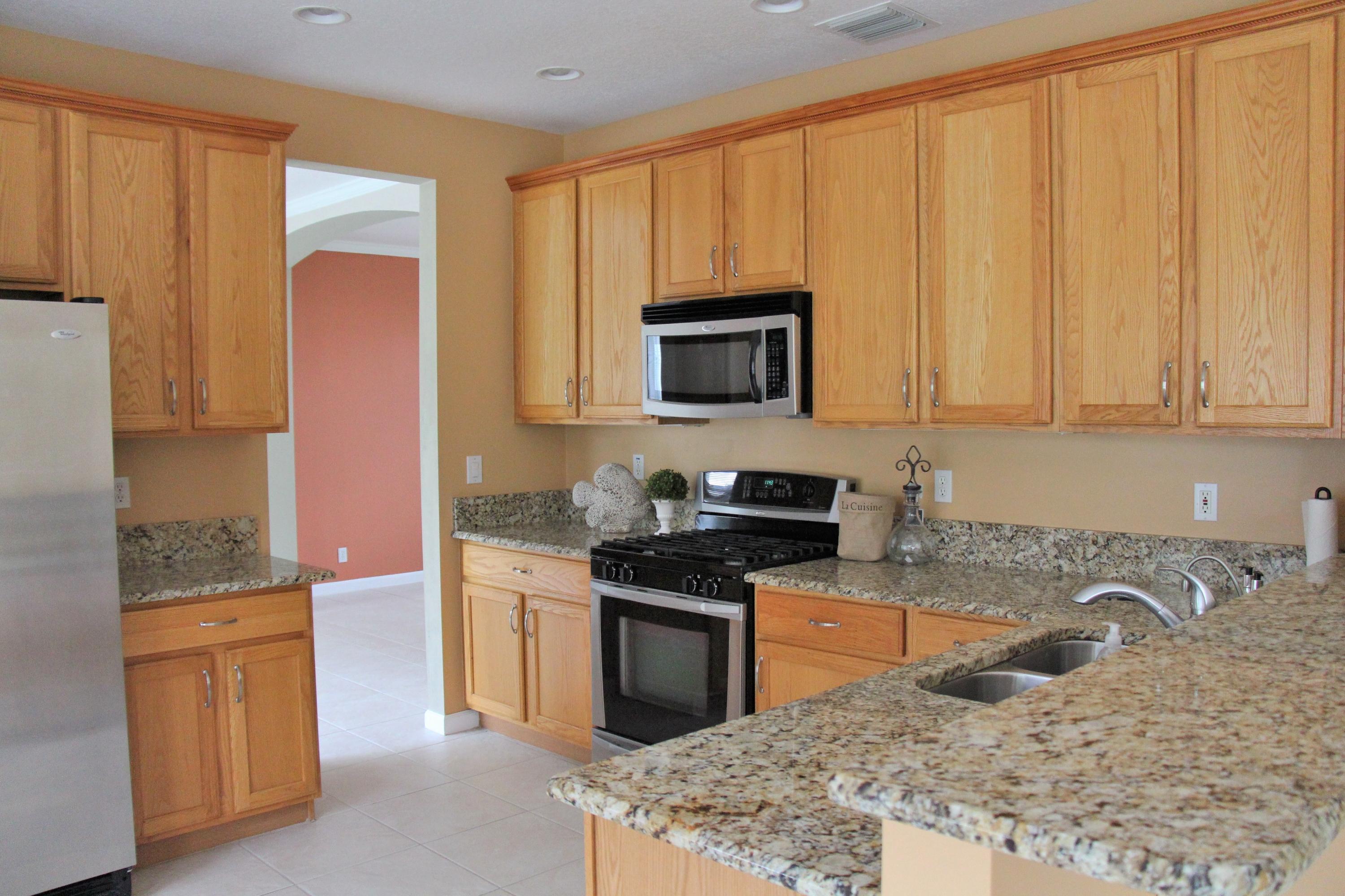 233 Sparrow Point Jupiter, FL 33458 - Photo 7 of 33 Kitchen opens to DR and Great Room