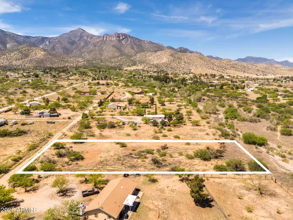 a view of a yard with a lake view