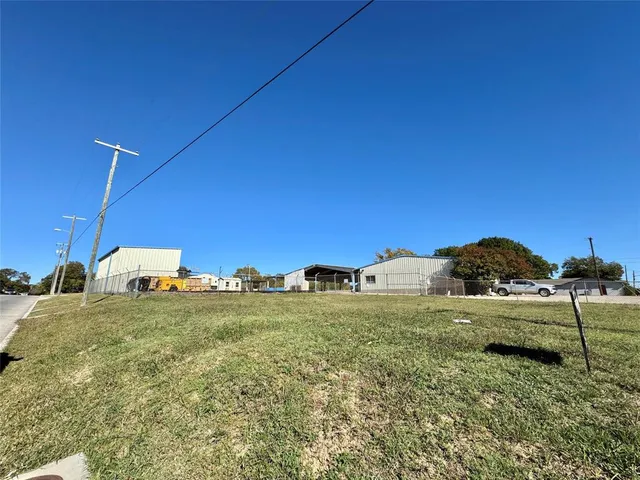 a view of a big yard with an outdoor space