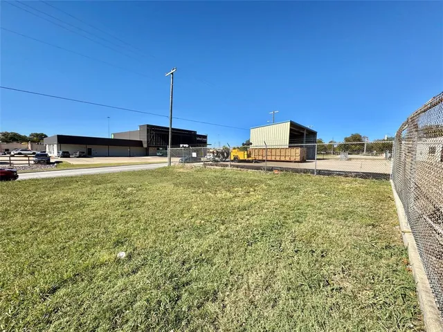 a swimming pool with outdoor seating and yard