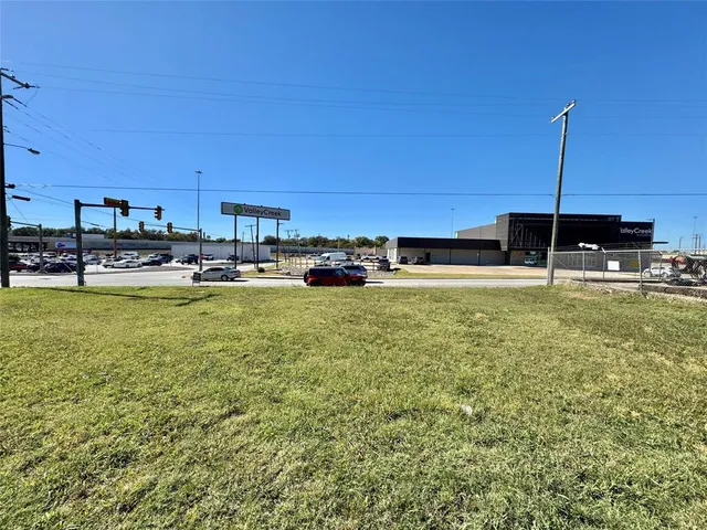 a swimming pool with lawn chairs