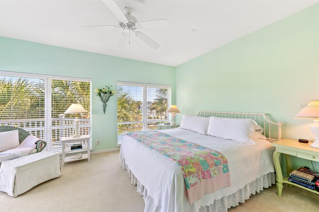 801 South Harbor Drive Boca Grande, FL 33921 - Photo 11 of 43 a bedroom with a bed and a couch