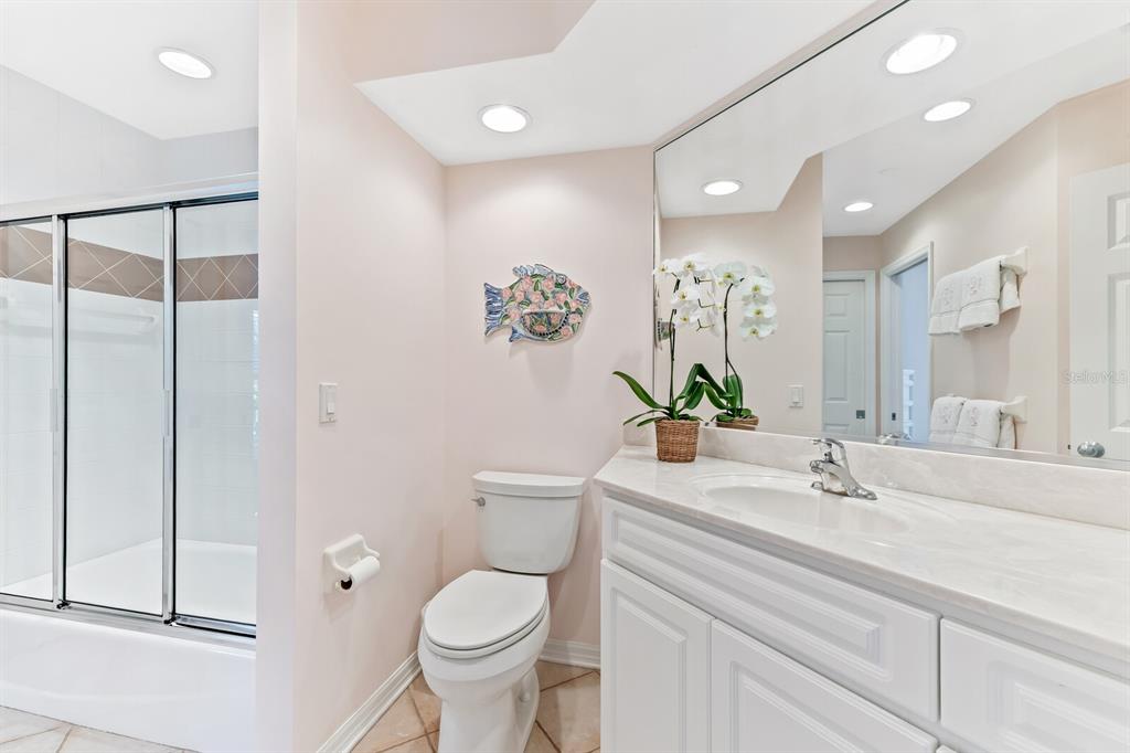 801 South Harbor Drive Boca Grande, FL 33921 - Photo 12 of 43 a bathroom with a sink a toilet and shower