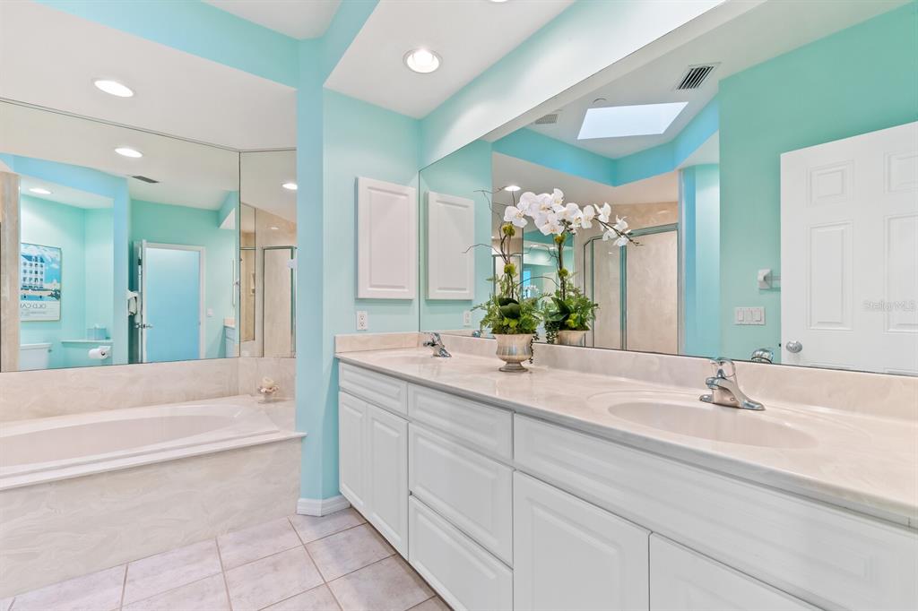 801 South Harbor Drive Boca Grande, FL 33921 - Photo 13 of 43 a bathroom with a bathtub sink and mirror