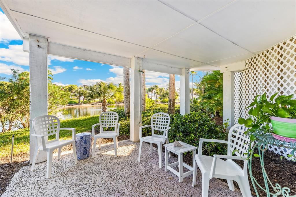 801 South Harbor Drive Boca Grande, FL 33921 - Photo 20 of 43 a view of a patio with table and chairs potted plants