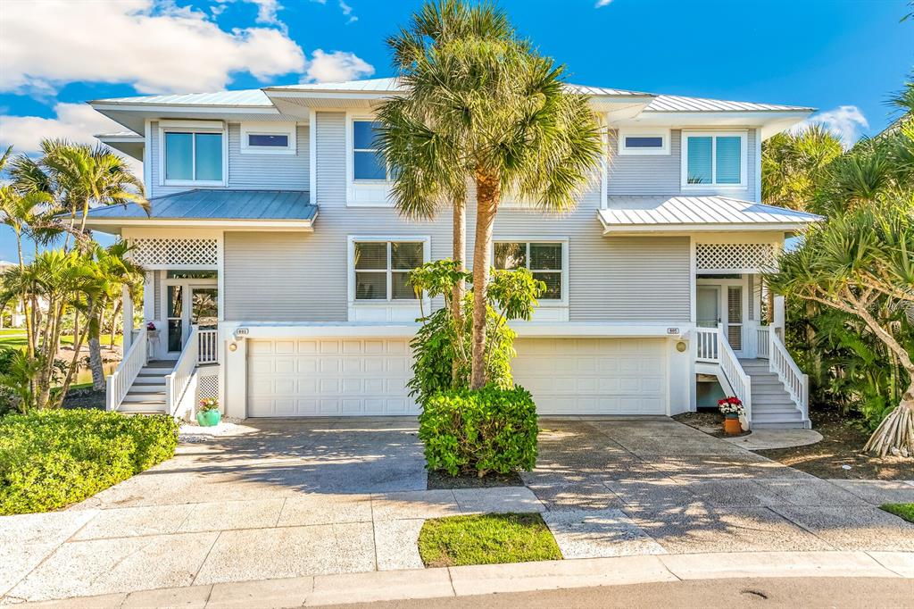 801 South Harbor Drive Boca Grande, FL 33921 - Photo 2 of 43 a front view of a house with garden