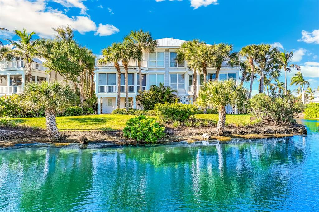 801 South Harbor Drive Boca Grande, FL 33921 - Photo 22 of 43 a view of a house with a yard and swimming pool