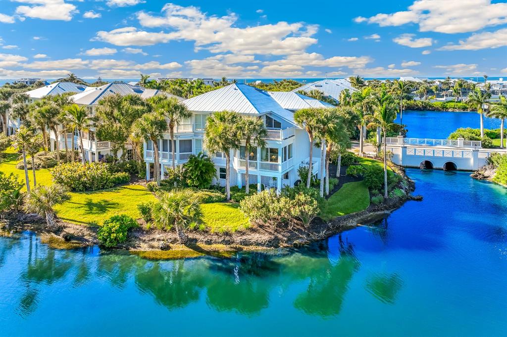 801 South Harbor Drive Boca Grande, FL 33921 - Photo 24 of 43 a view of a house with swimming pool and a yard
