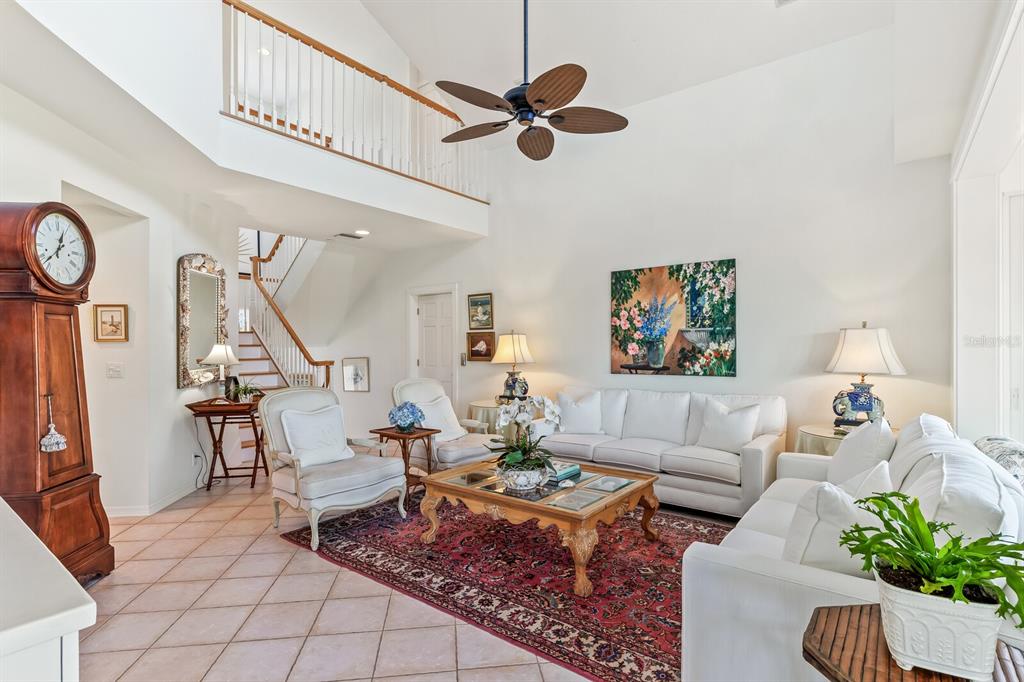 801 South Harbor Drive Boca Grande, FL 33921 - Photo 4 of 43 a living room with furniture a rug and a ceiling fan
