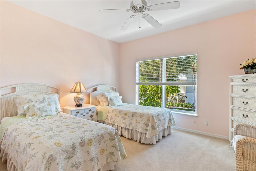 801 South Harbor Drive Boca Grande, FL 33921 - Photo 9 of 43 a bedroom with two beds and a window