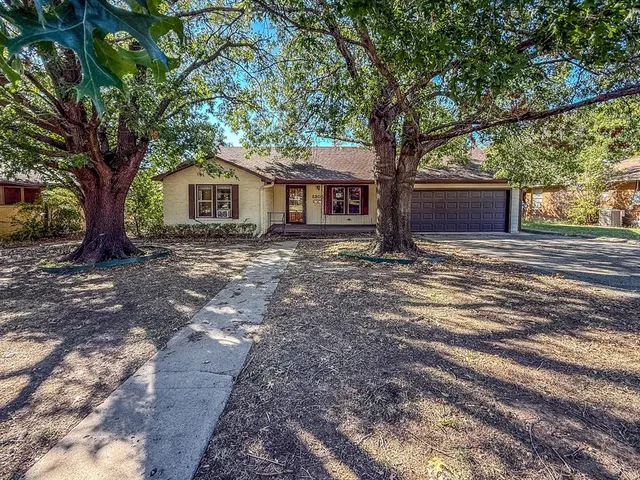 a house with trees in front of it