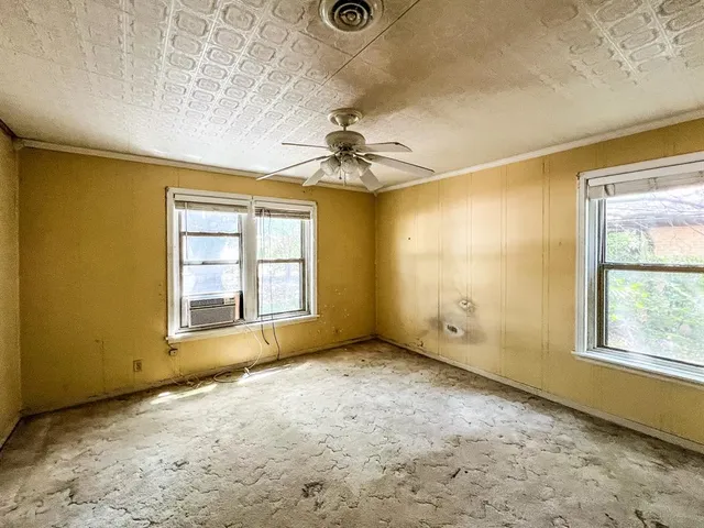 an empty room with windows