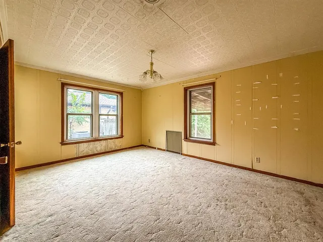 a spacious bathroom with a granite countertop sink and a mirror