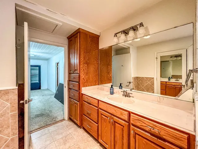 a white toilet sitting next to a window