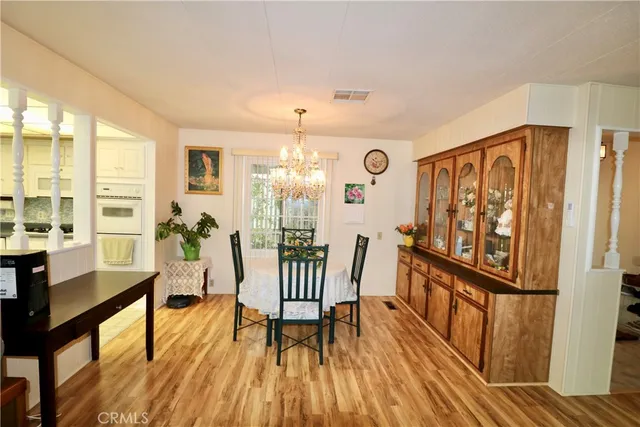 a view of a livingroom with furniture window and wooden floor