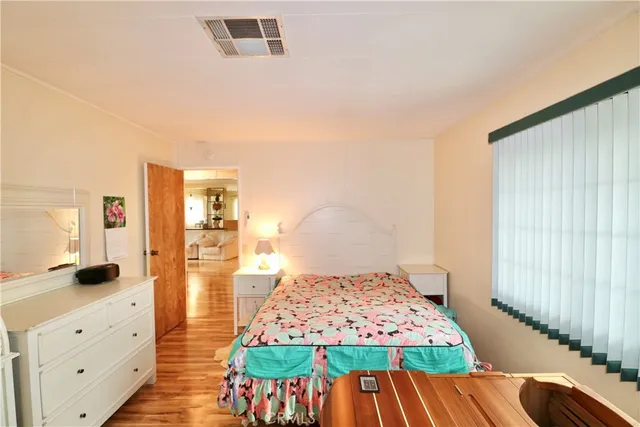 a bedroom with a bed and a view of bedroom