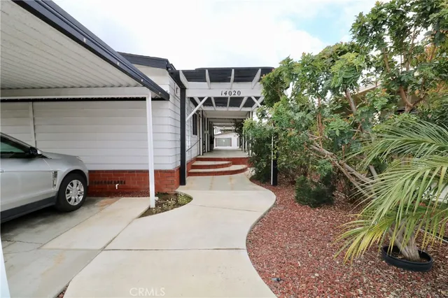 a view of a car in front of a house