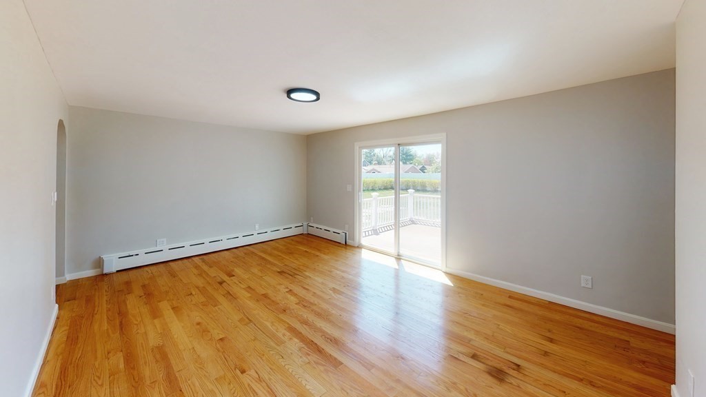 53 Druid Hill Road Springfield, MA 01129 - Photo 14 of 30 a view of an empty room with wooden floor and a window
