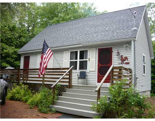 Exterior Front. Cape in the woods...