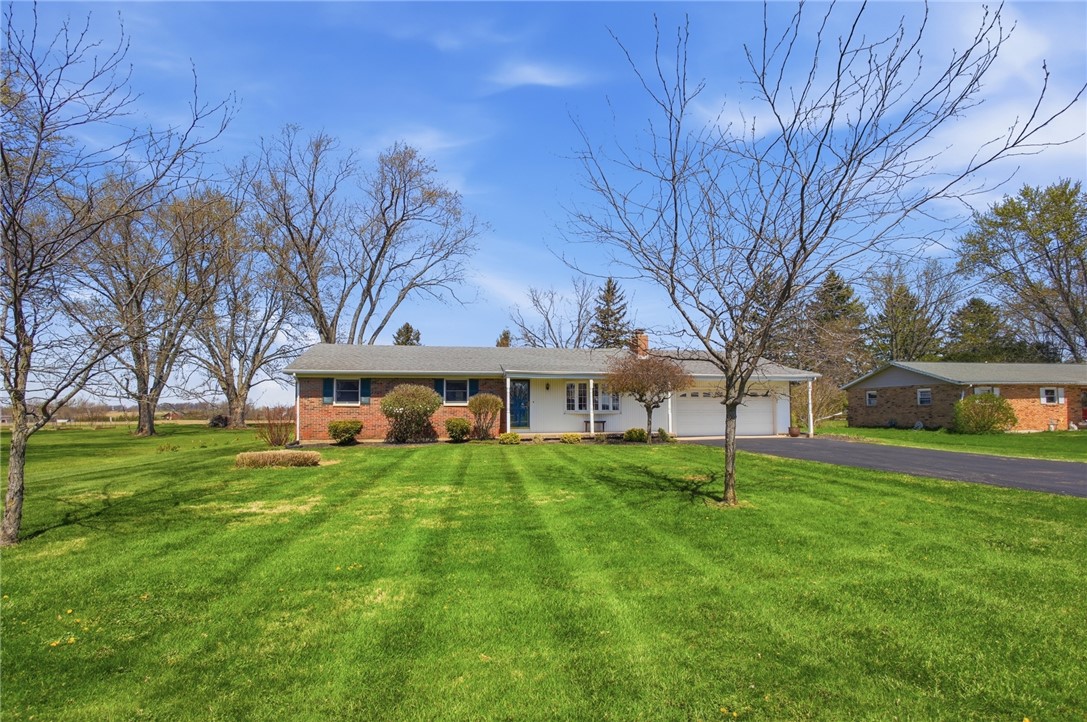 6718 Old Columbus Road South Vienna, OH 45369 - Photo 3 of 33 This charming home offers a spacious front yard and an inviting exterior.